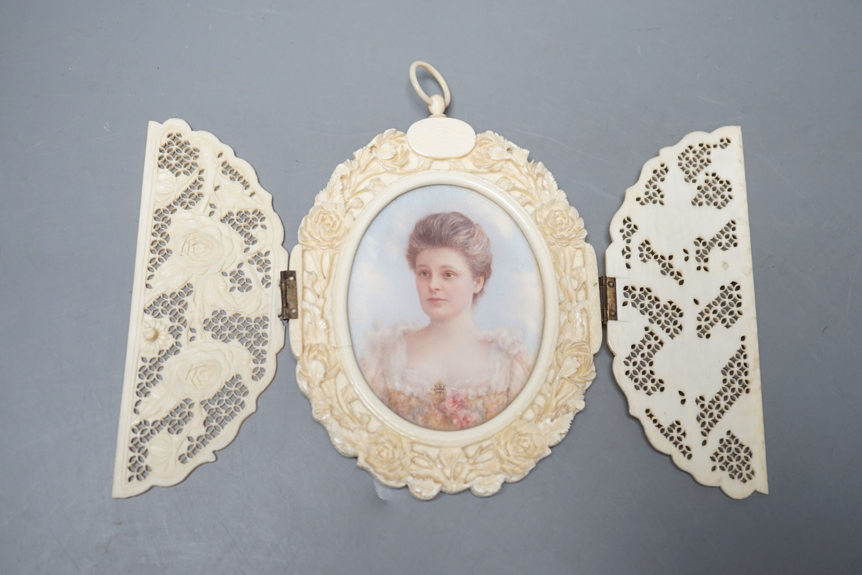 A carved and pierced ivory framed miniature. ‘Edith wife of C.Constable Curtis Esq. Collingshaw Newark - Painted by K.Wilfred Collyer 8th October 1892’ to reverse, 11.5cm high